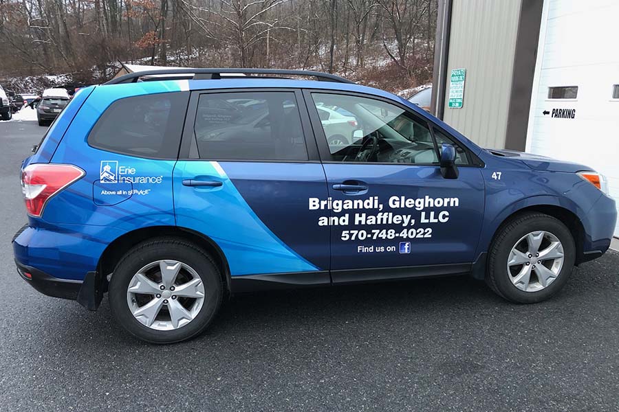 Insurance Quote - View of Parked Blue SUV with Brigandi Glefhorn & Haffley Branding and Erie Insurance Logo